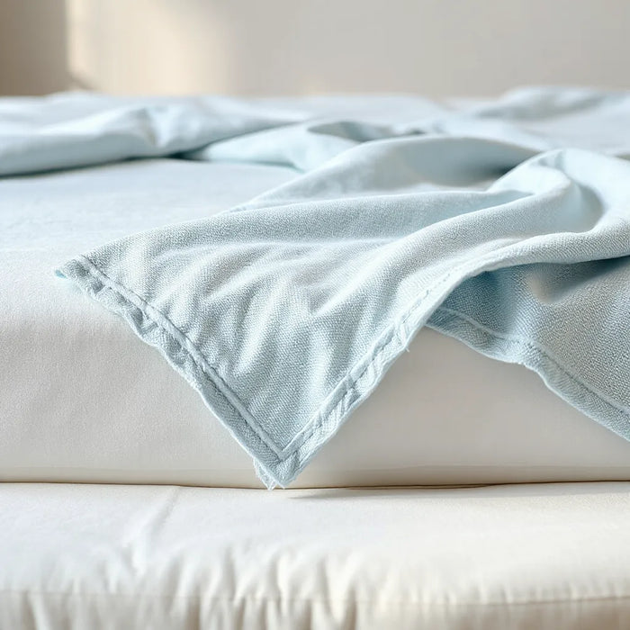 Cooling mattress cover fabric on a bed with a fresh, cool-touch texture
