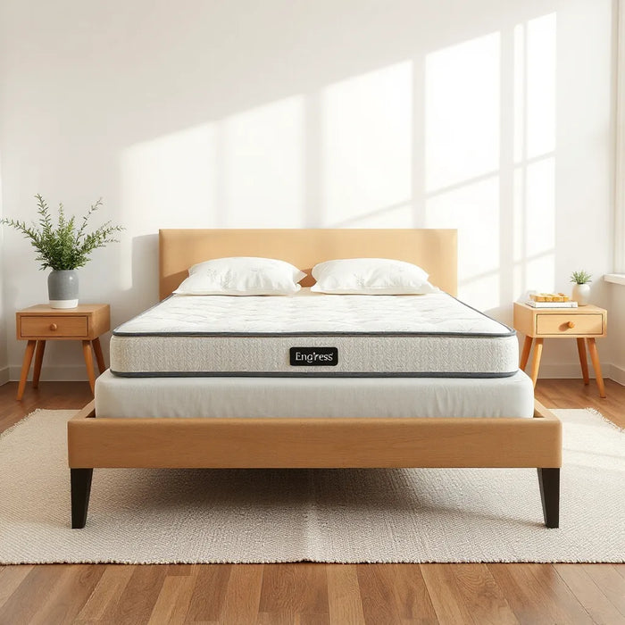 Luxury organic mattress on a modern bed with natural cotton bedding in soft daylight