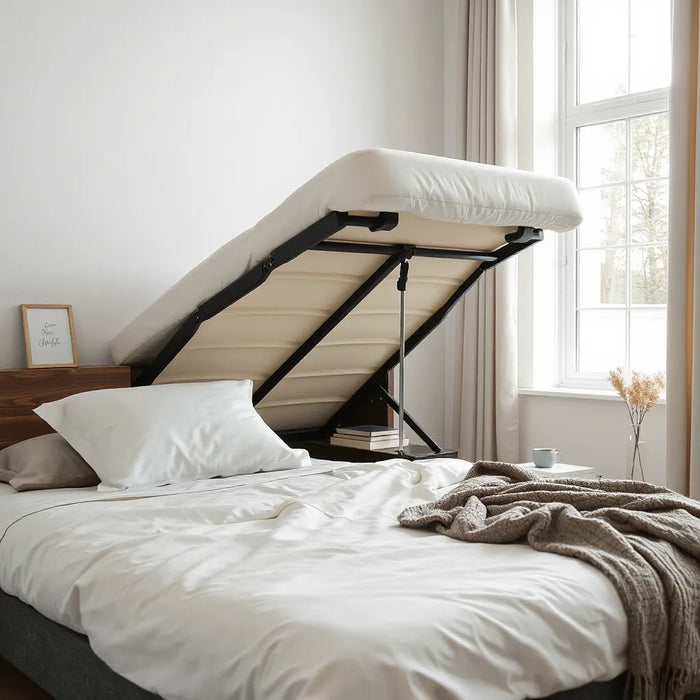 Modern adjustable bed frame with head and leg sections raised in a bright, minimal bedroom