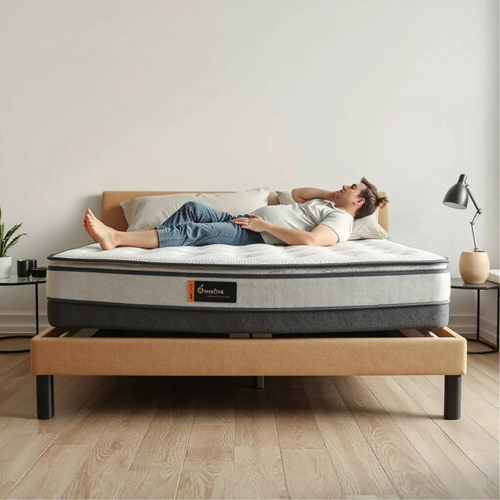 Sturdy mattress on a low bed with a heavy sleeper resting comfortably in a bright, minimal bedroom