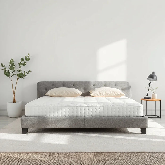 Puffy mattress on a modern bed in a bright, minimalist bedroom setting