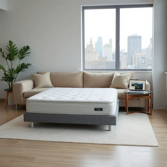 Neatly styled mattress with a laptop setup in a bright NYC living room