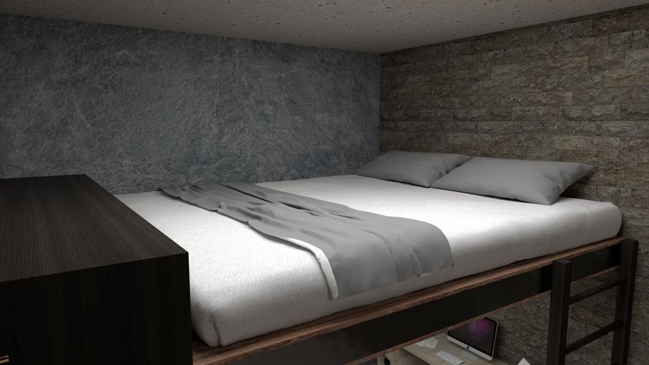 A cozy, minimalist bed with stone wall accent in a modern interior setting.