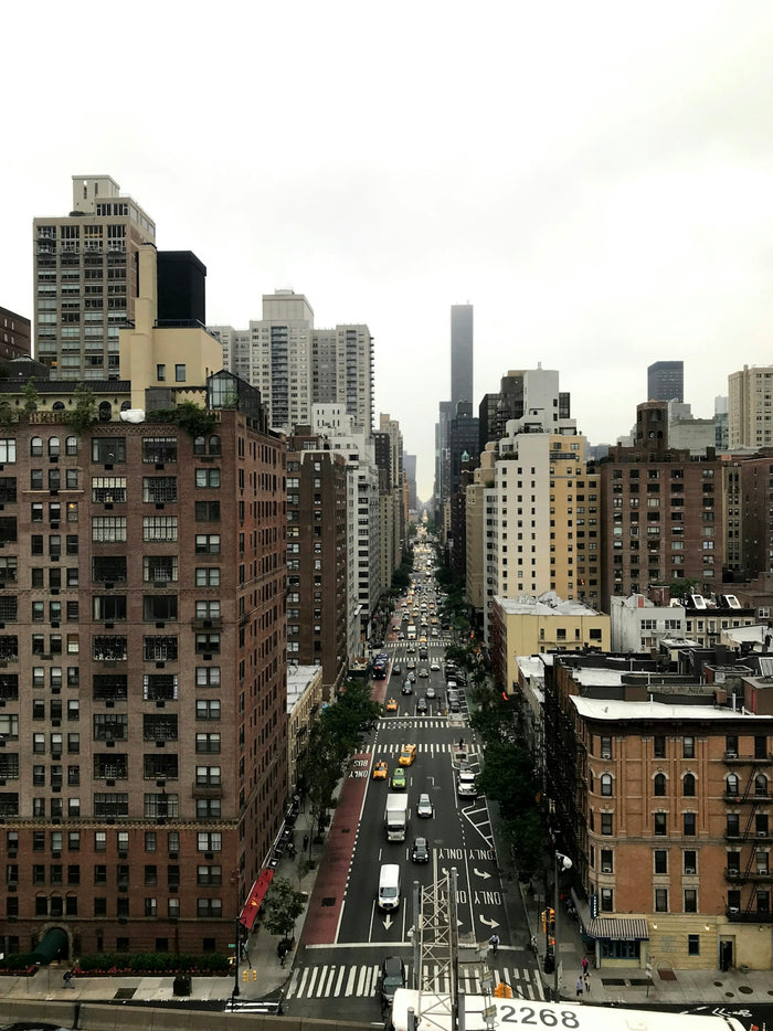 vehicle on street between buildings during daytime
