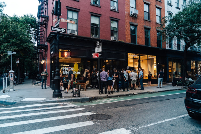people standing near building