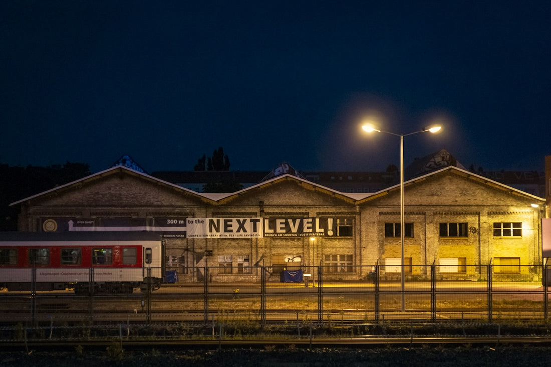 a train is parked in front of a train station