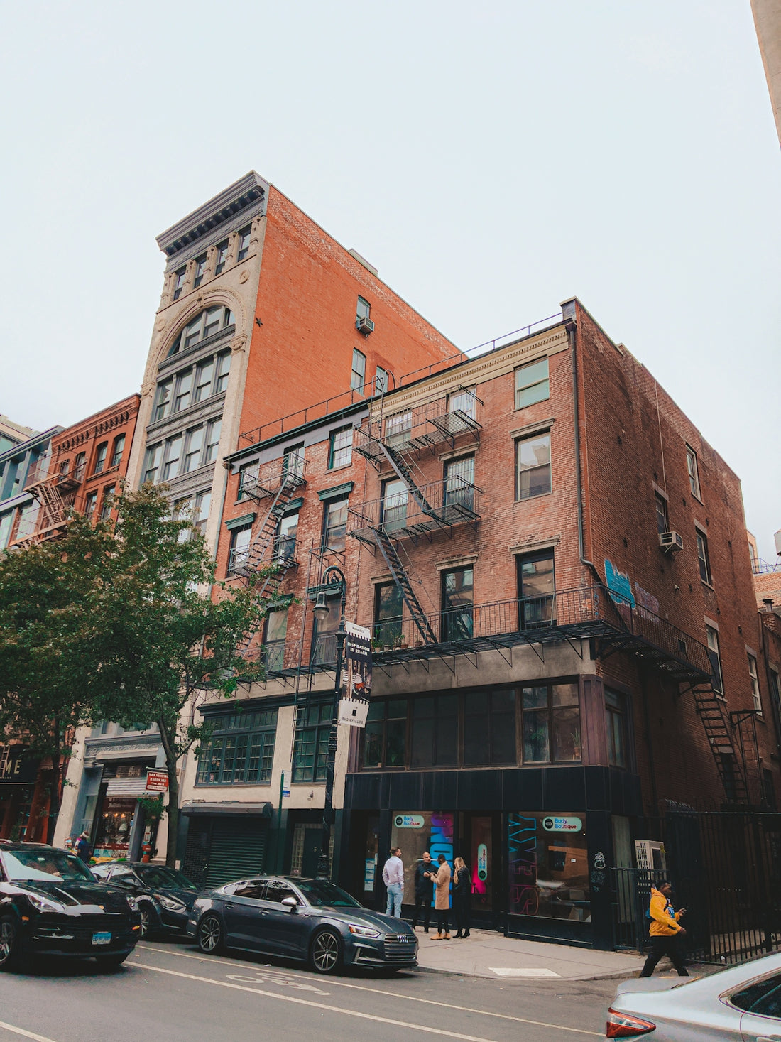 a building with a street and cars