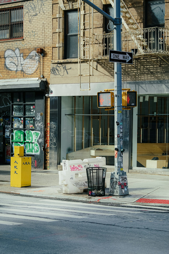 a street corner with graffiti on the building