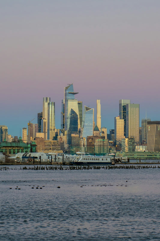 A large body of water with a city in the background