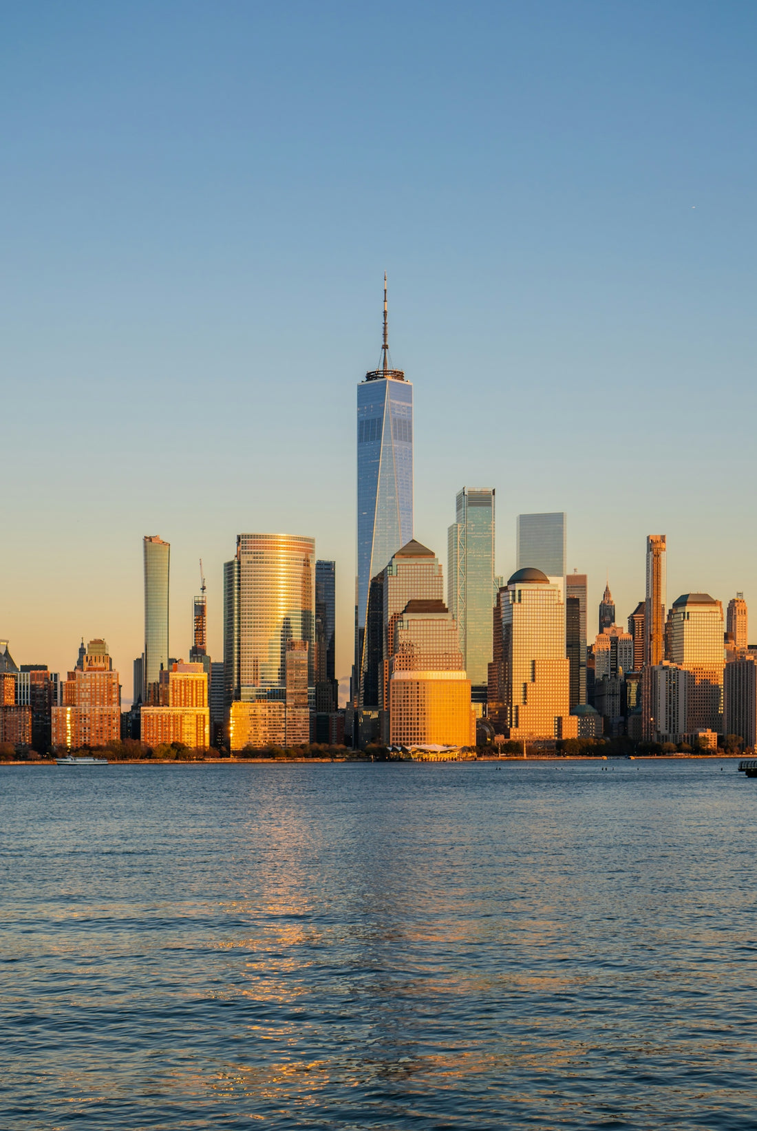 A large body of water with a city in the background