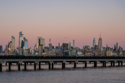 A large body of water with a city in the background