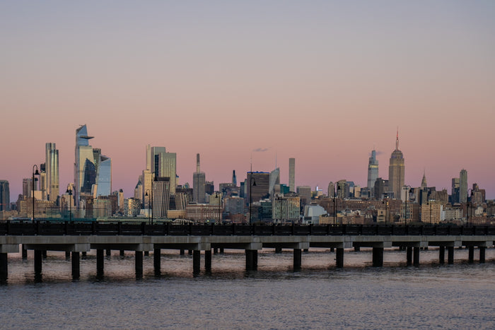 A large body of water with a city in the background