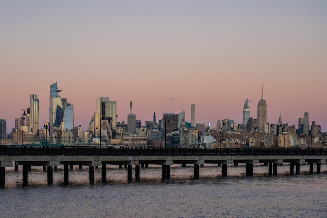 A large body of water with a city in the background