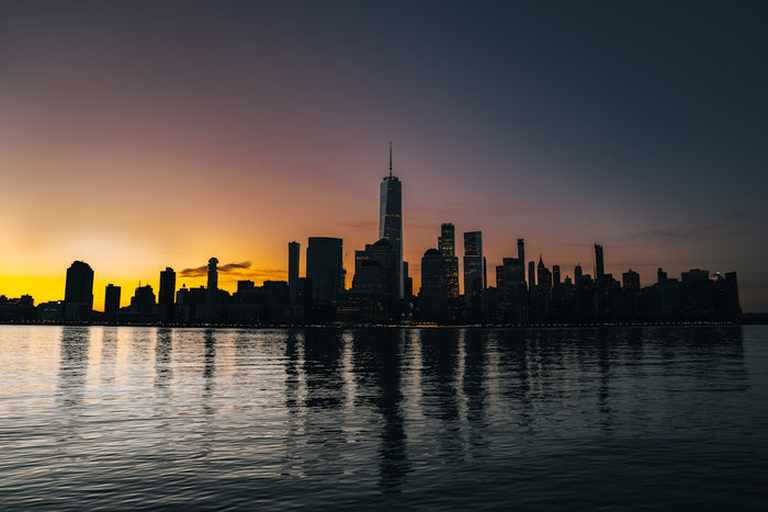 a view of a city skyline at sunset