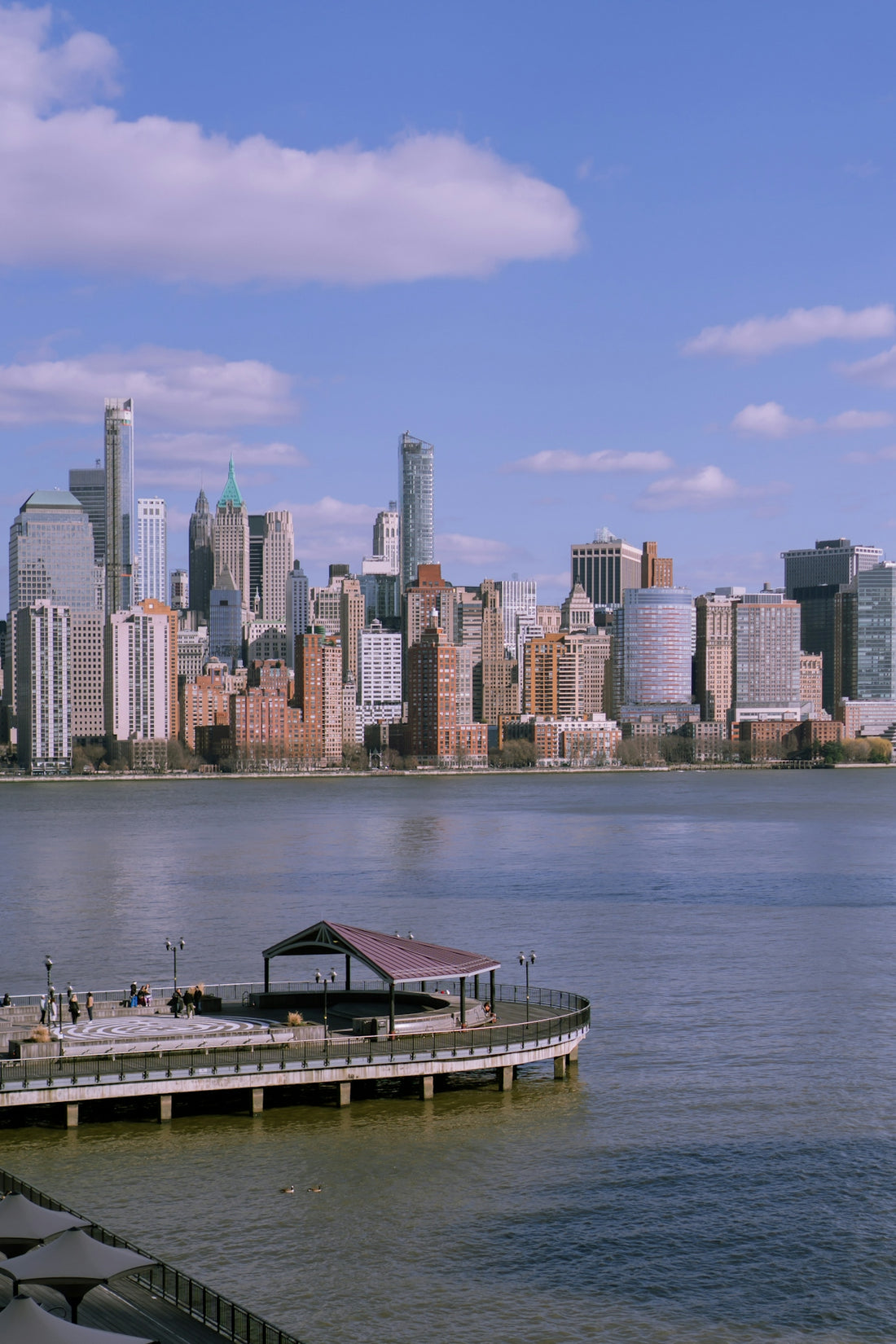 A boat dock in front of a large city