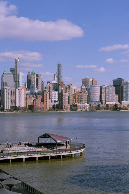 A boat dock in front of a large city