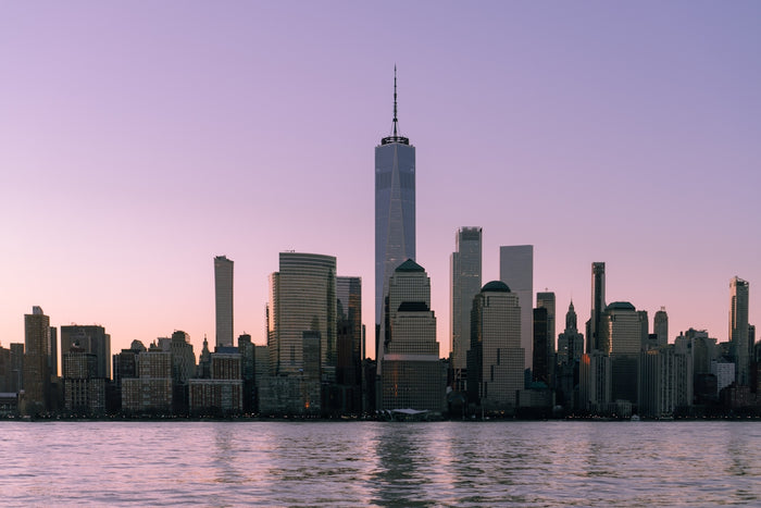 A large body of water with a city in the background