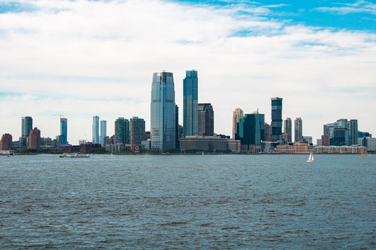 A large body of water with a city in the background