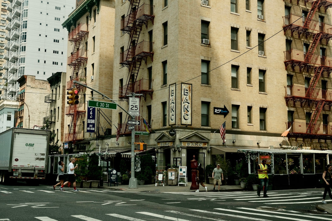 A very tall building sitting on the corner of a street