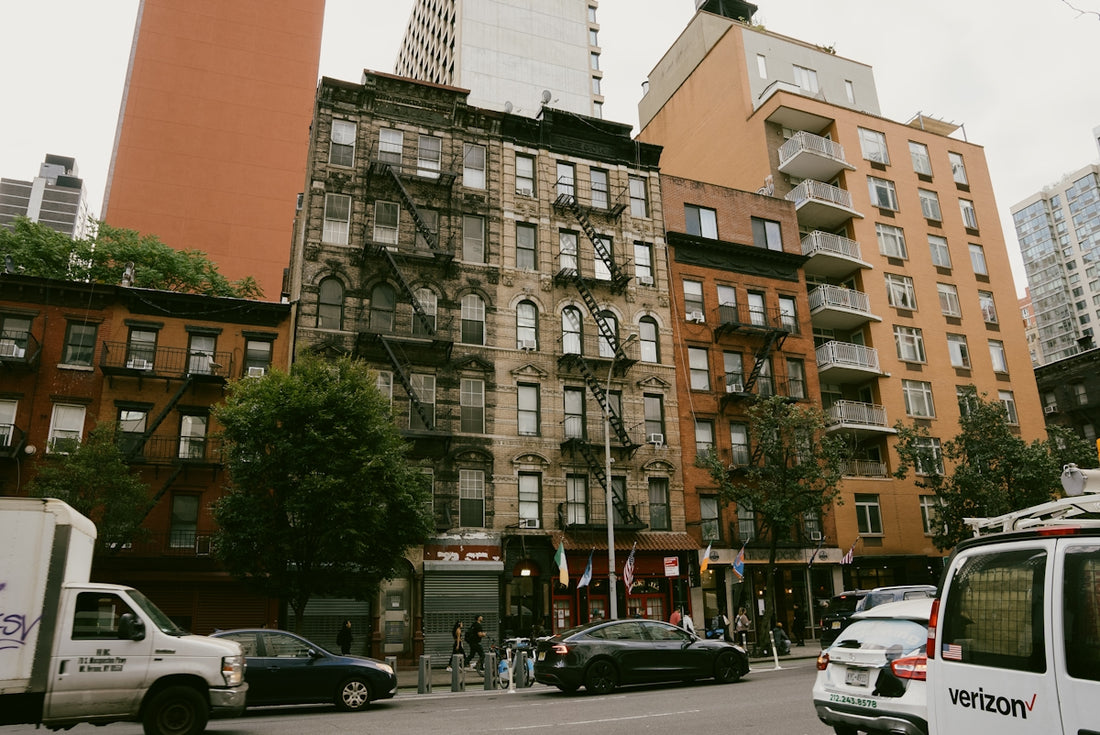 A city street filled with lots of tall buildings
