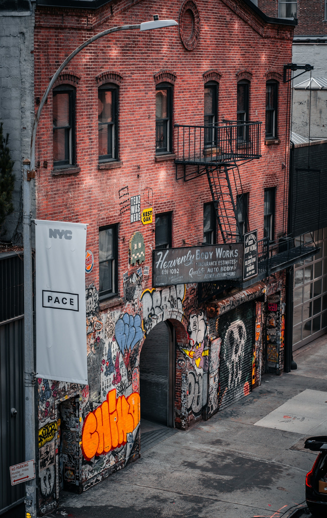 A brick building with graffiti on the side of it