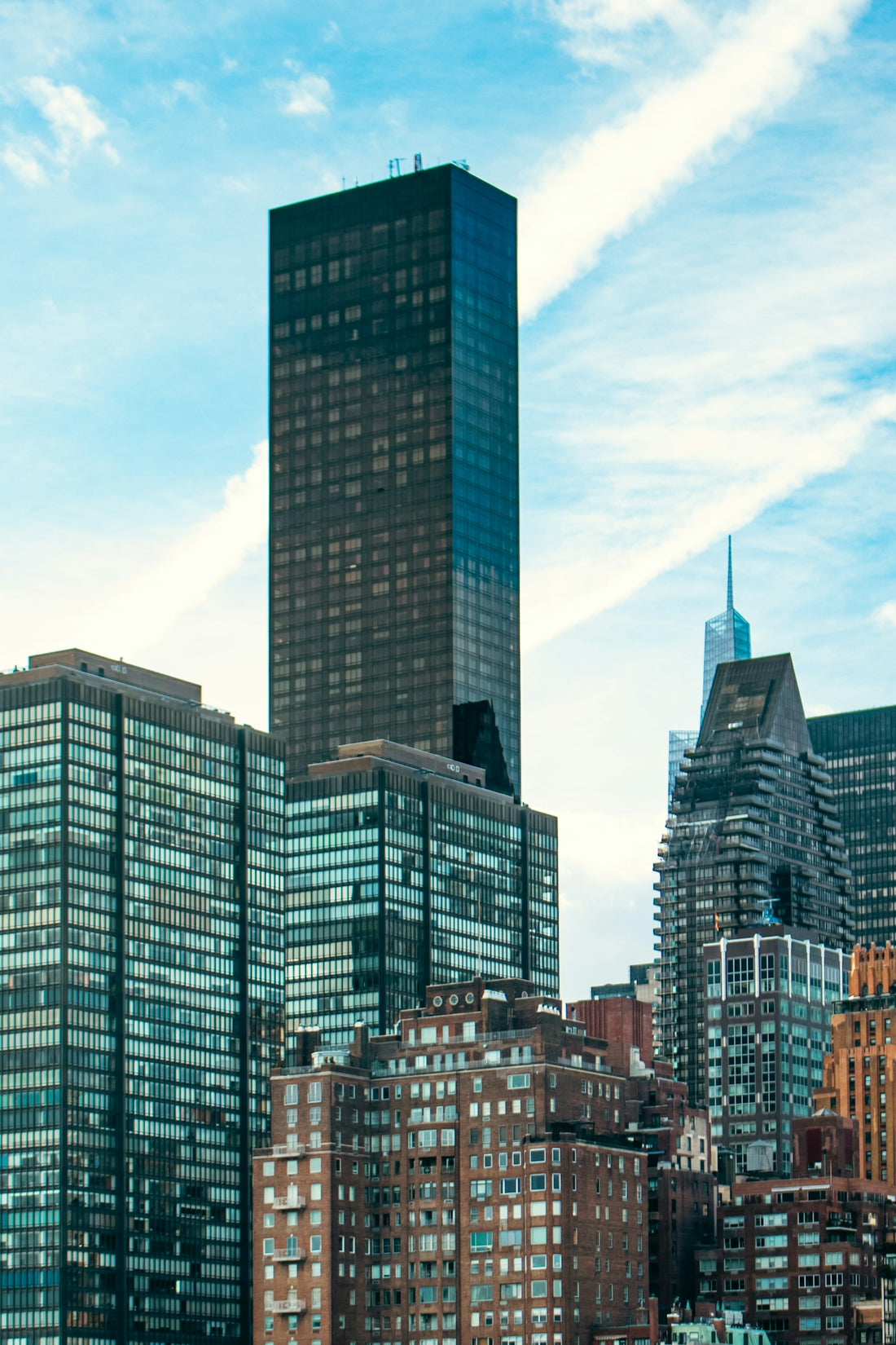 Skyscrapers of new york city reach into the sky.