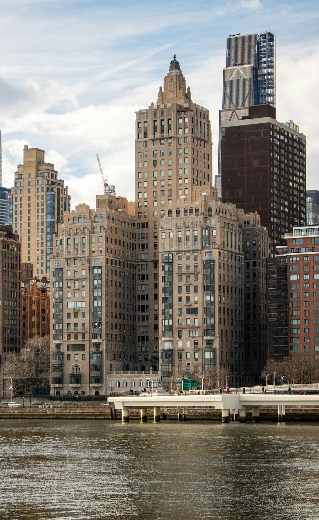 Buildings in new york city's skyline, from the water.