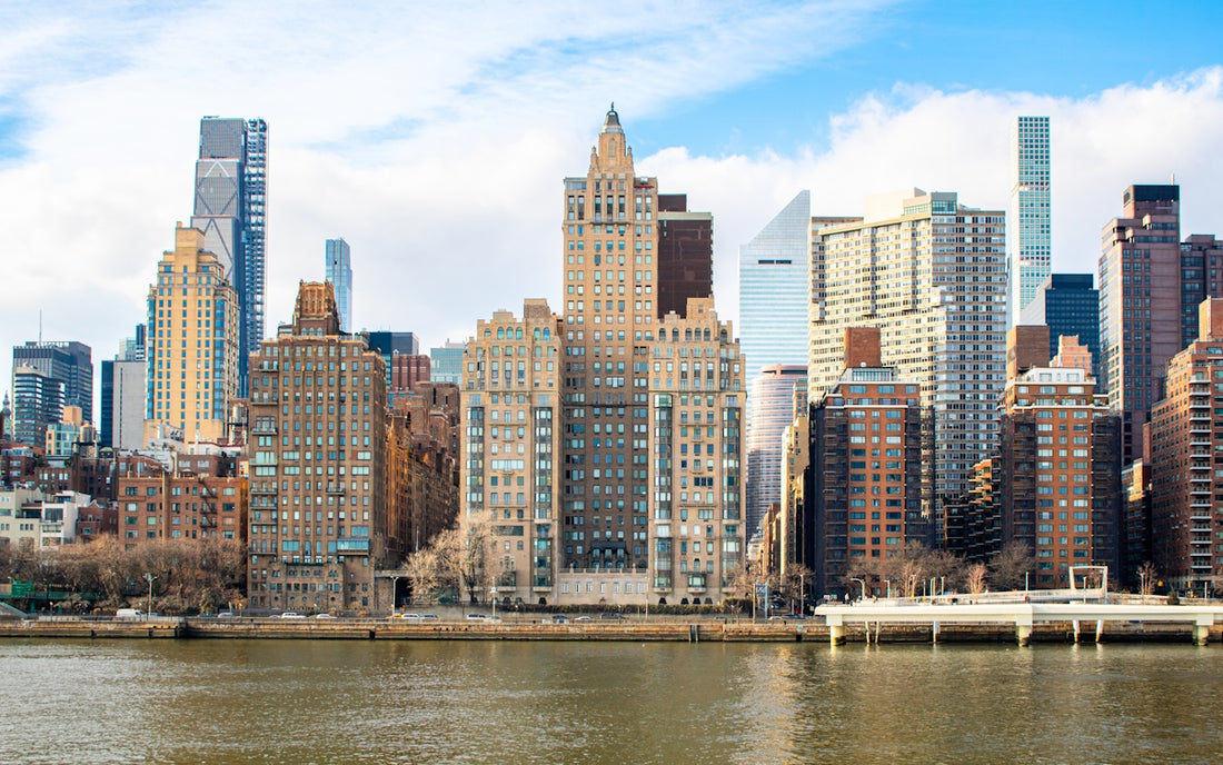 New york city skyline is visible across the water.