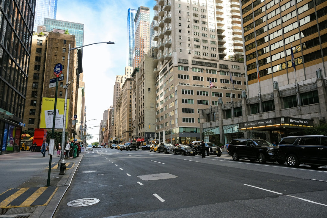 City street with tall buildings and cars
