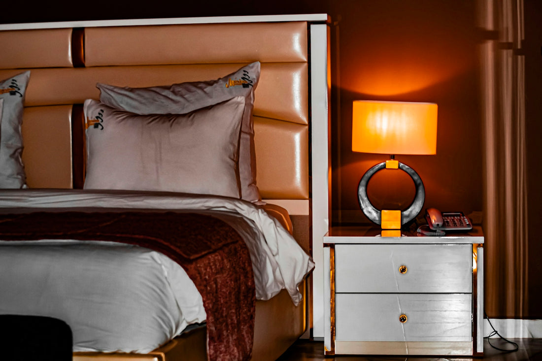 Luxurious bedroom with a lit bedside lamp