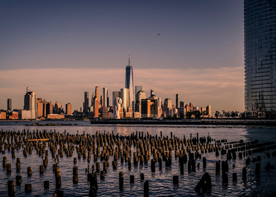 City skyline at sunset over calm water
