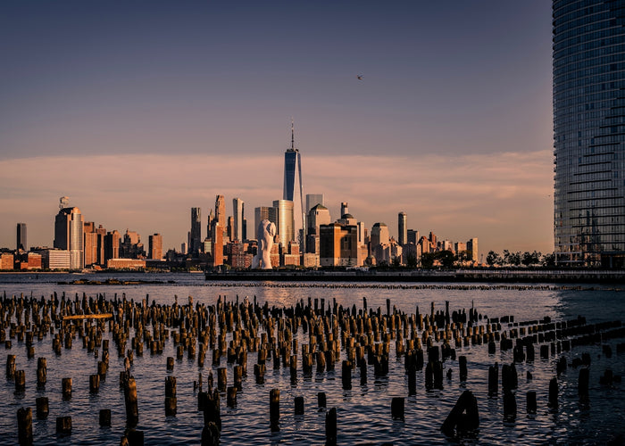 City skyline at sunset over calm water