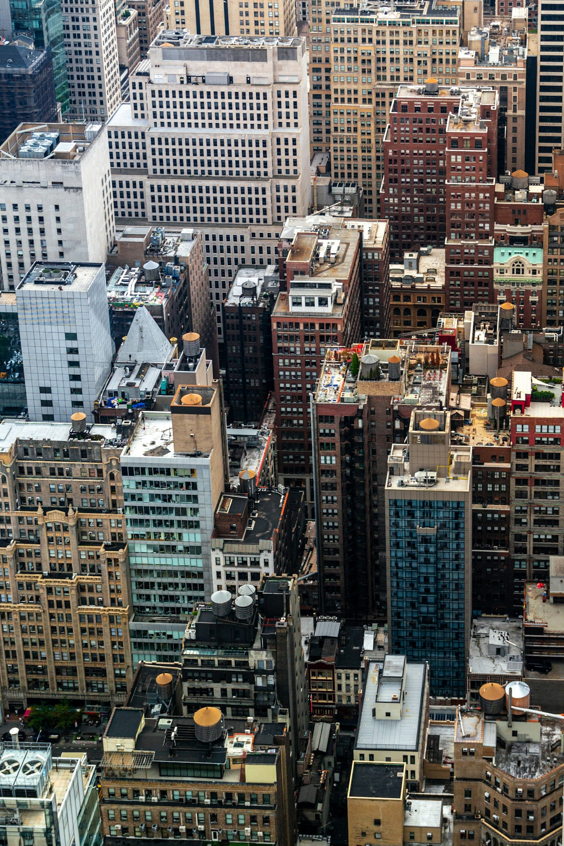 Aerial view of dense city buildings and streets.