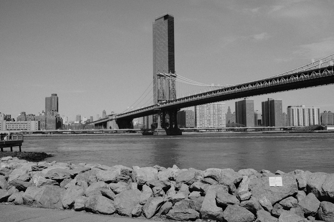 New york city skyline with manhattan bridge and river.