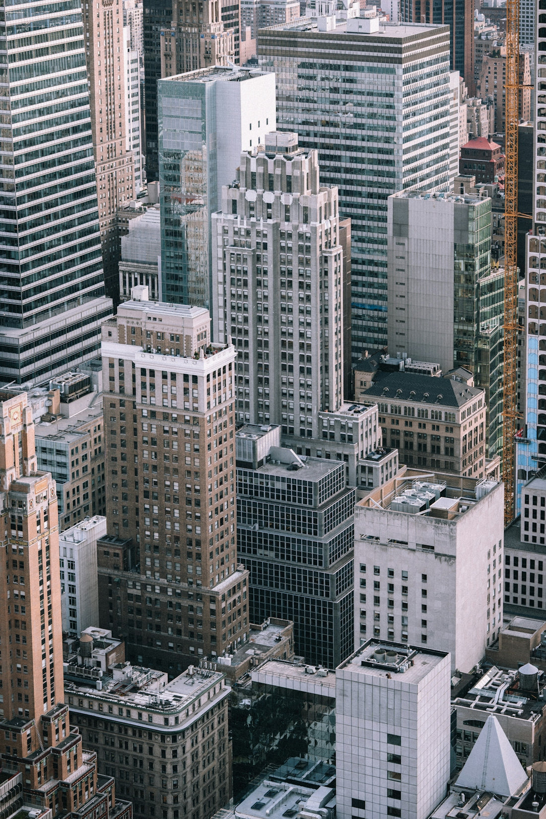 An aerial view of dense skyscrapers and office buildings in New York City
