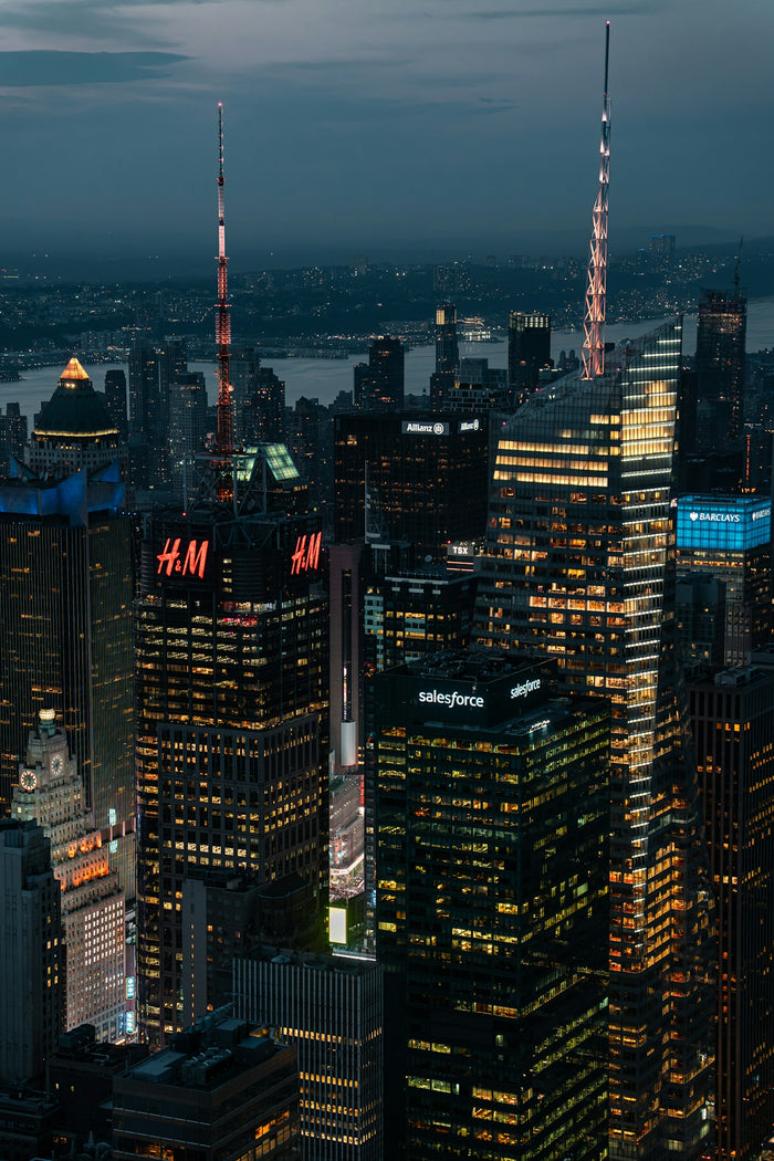 Aerial view of illuminated skyscrapers in New York City at dusk