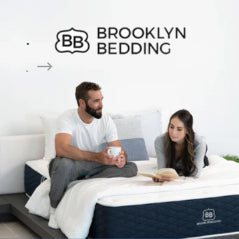 Brooklyn Bedding luxury hybrid mattresses and bedding displayed in an NYC showroom, featuring various firmness and pillow top options.